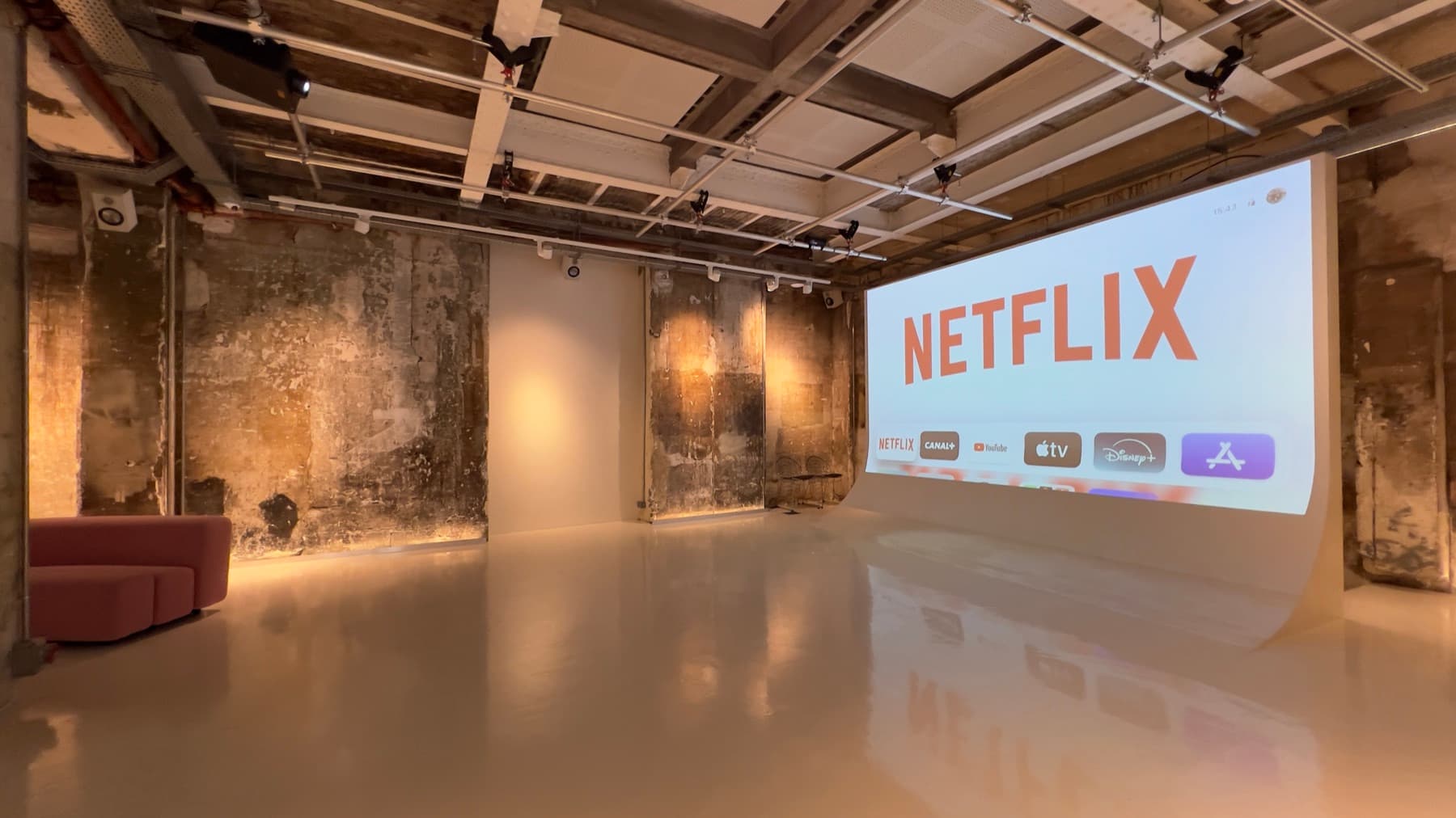 Projection cyclorama with exposed stone walls — Chez Les Plombiers