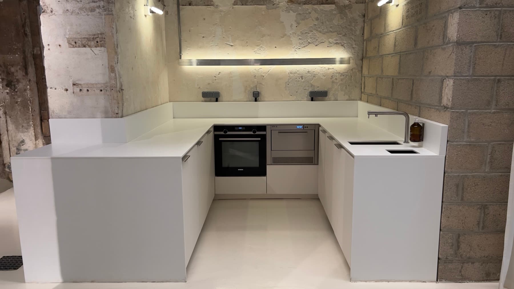 Workspace with desk, designer chairs and kitchenette — Chez Les Plombiers